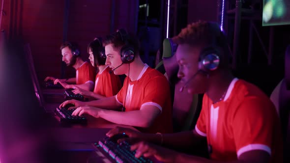 Focused Gamers Plays a Video Game Cyber Sportsmans Communicates During the Intense Game Team Won the