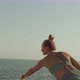 Blond Young Fit Attractive Caucasian Woman Practice Yoga on a Rock Near the Sea - VideoHive Item for Sale