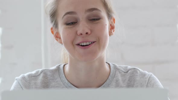 Online Video Chat By Young Woman at Work