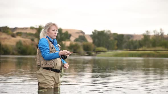 Woman Retrieving Fly Line