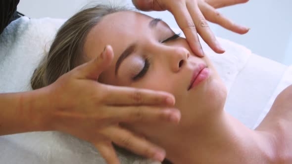 Woman Gets Facial and Head Massage in Luxury Spa