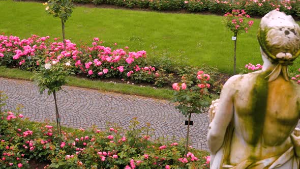 An Old Statue In The Park Against The Background 1