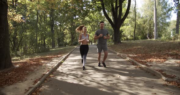 Girl and guy morning jogging sport