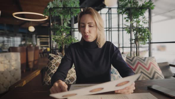 Attractive Woman in a Cafe at a Business Lunch