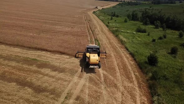 Aerial View of Combine Harvesters Agricultural Machinery. The Machine for Harvesting Grain Crops.