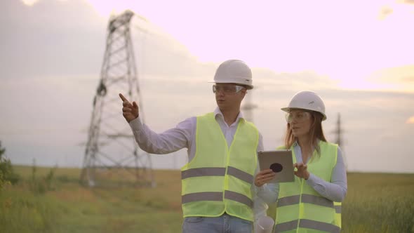 Coworking Engineers with Tablets on Solar Plant