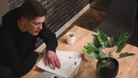 Serious Young Businessman Has Conference Video Calling By Webcam Working with Papers Focused Student