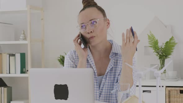 Female Consultant is Speaking on Phone