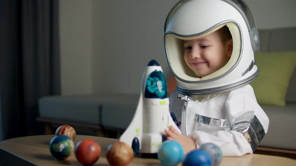 Child Playing at Home in an Astronaut Portrait of a Little Boy 5 Years Old in an Astronaut Costume