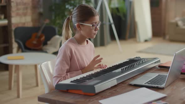 Girl Having Online Music Lesson