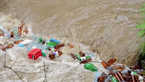 Plastic garbage in the river. Huge pile of plastic garbage
