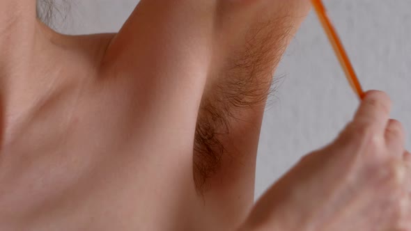 Female Combs Their Unshaven Armpits