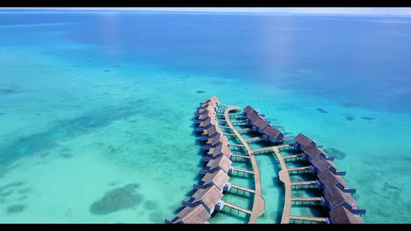 Aerial flying over landscape of perfect sea view beach time by aqua blue lagoon and white sandy back