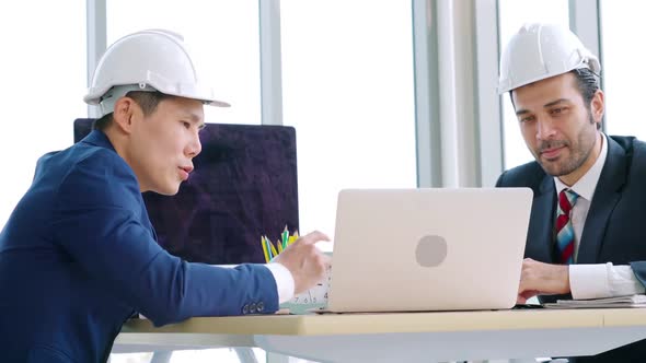 Engineer and Architect Meeting at Office Table