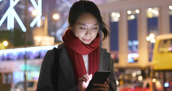 Woman use of mobile phone at outdoor