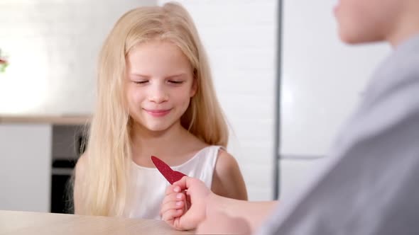 Little Boy Gives His Beloved Girl Valentines Day Red Heart Present