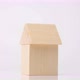 A toy house made of a wooden cube and a triangle in the form of a roof rotates on a white background - VideoHive Item for Sale