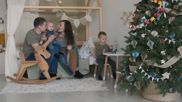 Young Family Celebrating Christmas at Home