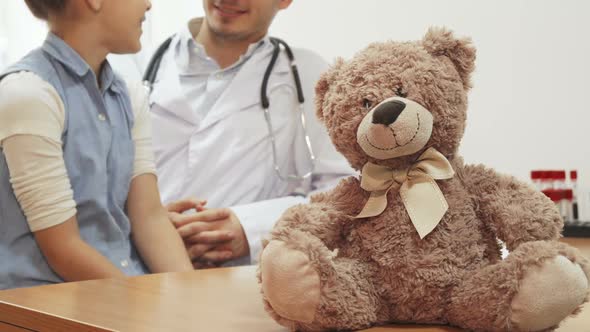 During the Reception of the Girl at the Doctor, on the Table Sits a Small Teddy Bear 1080p