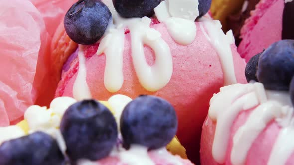 Handmade Beautiful Macaroon Sweet Food Dessert with Fresh Strawberries and Blueberries Decorated