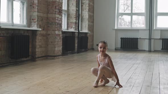 Little Ballerina Standing On Toes In Studio