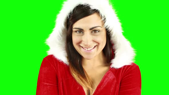 Smiling pretty woman posing in sexy santa outfit