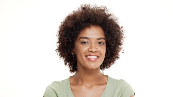 Young Beautiful African Girl Smiling Over White Background