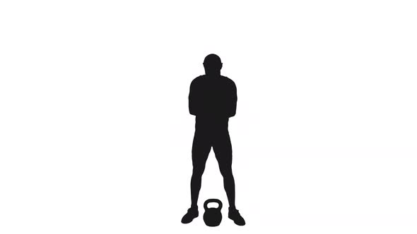 Silhouette Of Male Athlete Pushing Kettlebell By One Hand alt