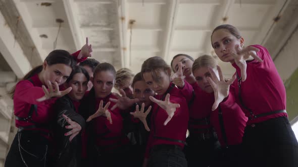 A Crowd of Young Girls and Guys in Same Stage Costumes Emotionally Showing Part of Performance