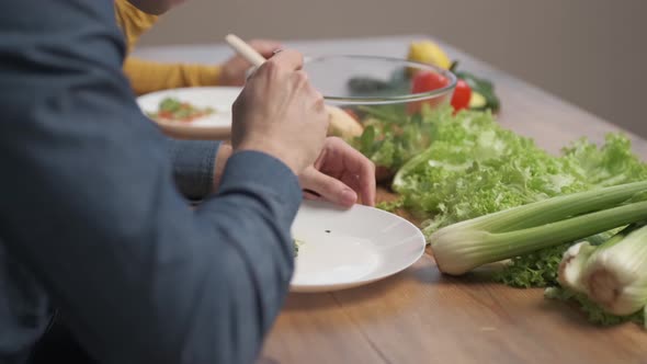 A man eating a vegetarian salad of fresh vegetables. Sports Nutrition and Healthy Eating