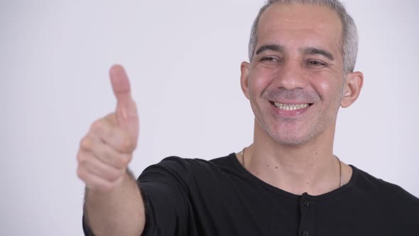 Happy Persian Man Giving Thumbs Up Against White Background