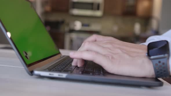 Hands Typing In Laptop With Green Screen Pan Camera