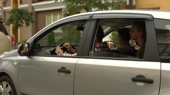 Happy Family Sitting in Car and Smiling Into Camera, Automobile Buying Service