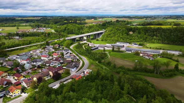 Village with Highway on the River with Forest Drone Video