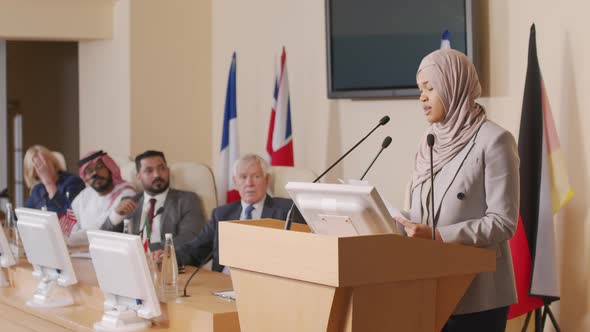 Muslim Female Politician Making Speech on Tribune