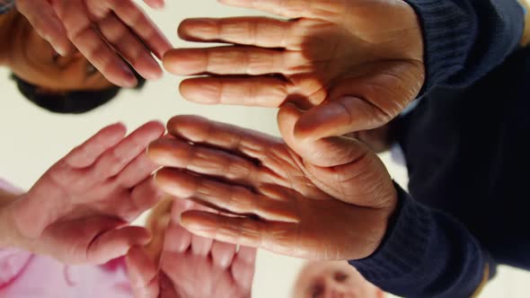 Group of people forming handstack 4k