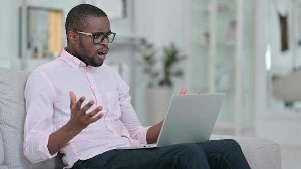 Failure African Man Having Loss on Laptop at Home
