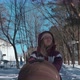 A Young Mother Walks with Her Child in a Stroller on a Clear Winter Day - VideoHive Item for Sale
