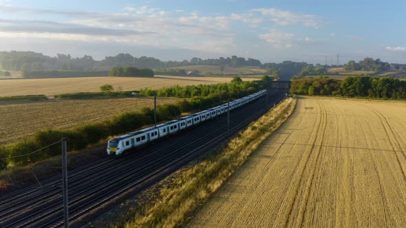 train aerial view. The movement of a train at high speed between the vineyards, top view. 