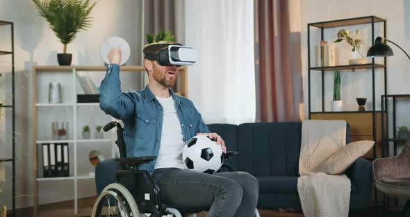 Disabled Man in Wheelchair After Accident Watching Football Match Using Virtual Reality Headset