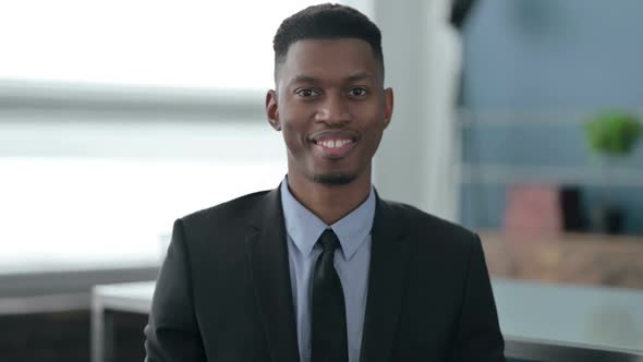 Portrait of African Businessman Shaking Head as Yes Sign, Approval