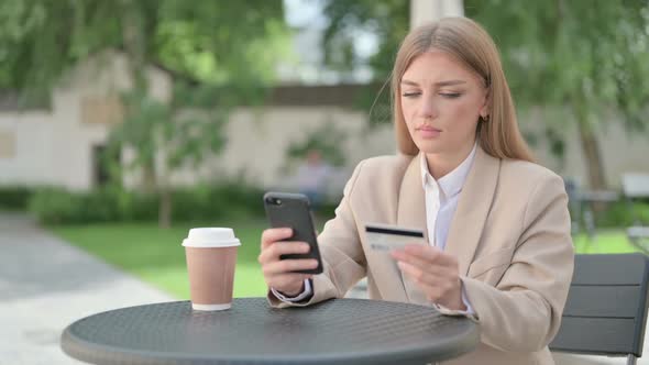 Young Businesswoman with Unsuccessful Online Payment on Smartphone