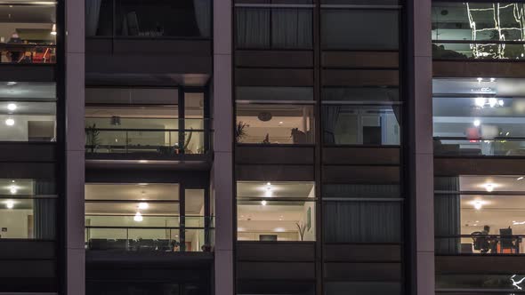 Big Glowing Windows in Modern Office and Residential Buildings Timelapse at Night