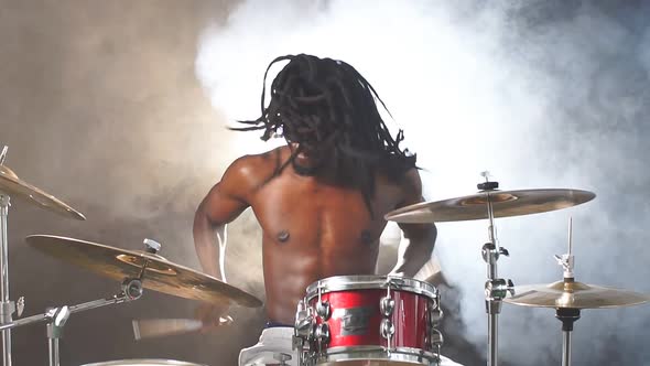 Portrait of Active African Man Playing on Drums Set in Music Studio