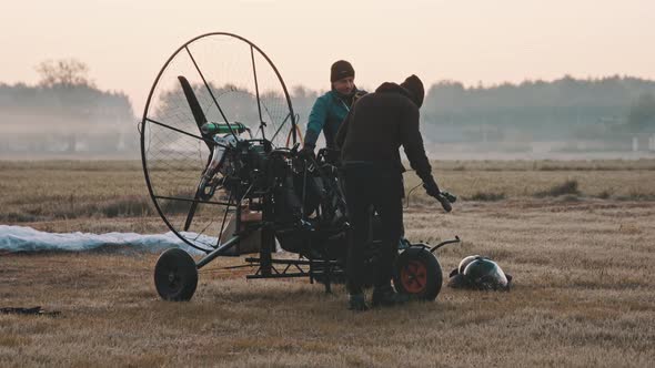 Client Getting on Paramotor Trike Preparing for Start