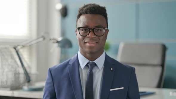 Portrait of Attractive African Businessman Smiling at Camera