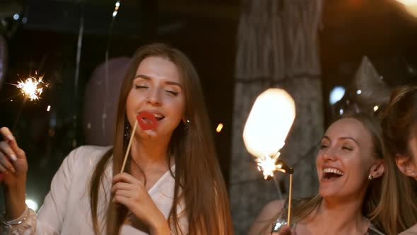 Girls with Sparklers and Photo Props