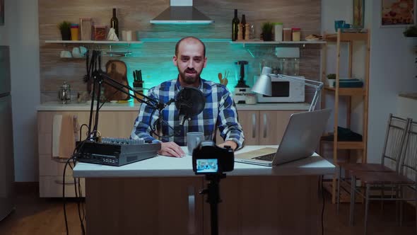 Man Sitting at Recording Station