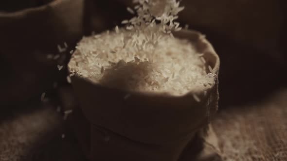 Rice is Falling on Burlap in Slow Motion