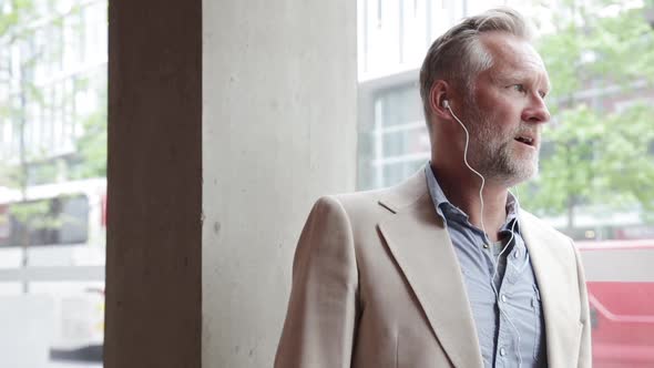 Businessman having phone call in coffee shop